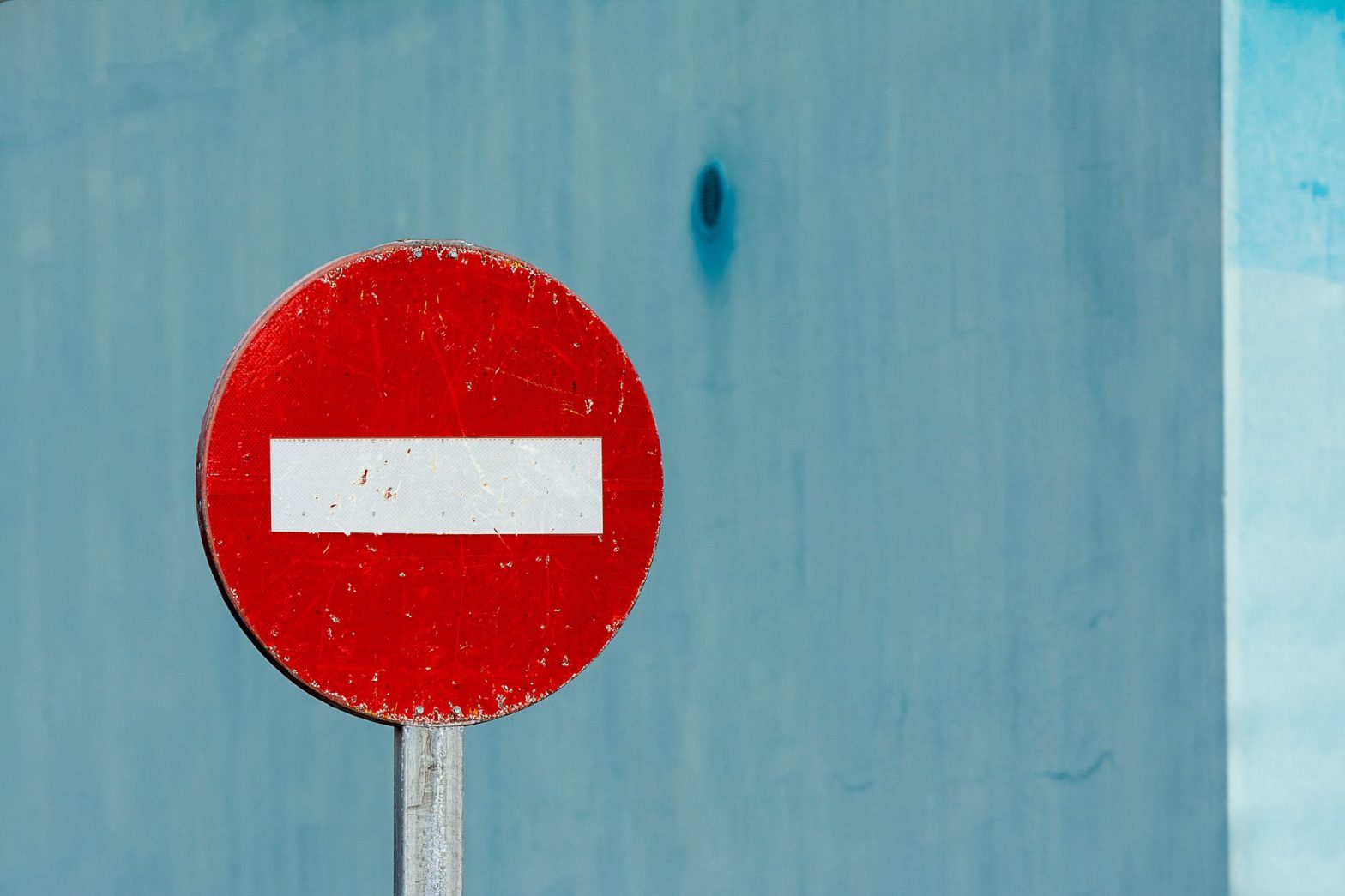 a red and white road sign